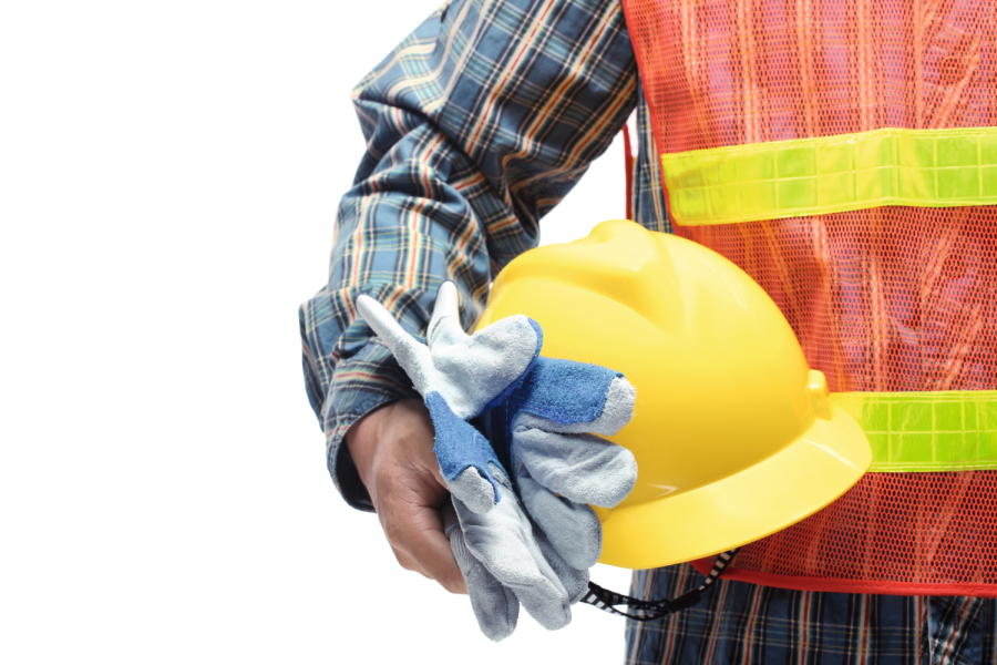 man holding yellow helmet isolated on white Bild: lily/stock.adobe.com